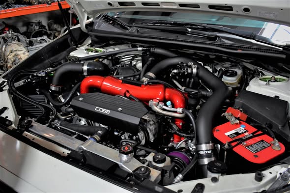 Engine bay of Keith’s white STI, photographed in AWD’s December 2018 post